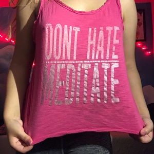 pink “Don’t hate, meditate” crop top